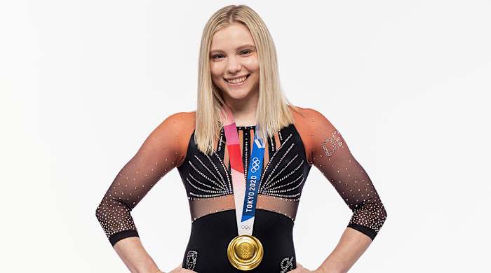 Jade Carey poses while wearing an Oregon State leotard and her Olympic gold medal.